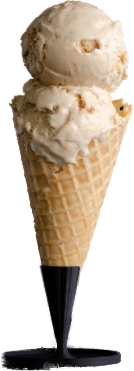 Peach cobbler ice cream in a waffle cone